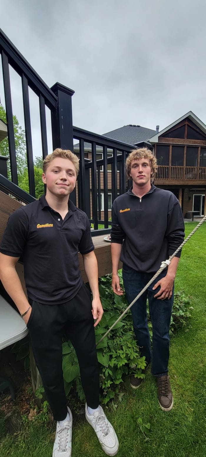 Joseph Murray and the Grandvista crew in branded gear at a customer's home in the north metro